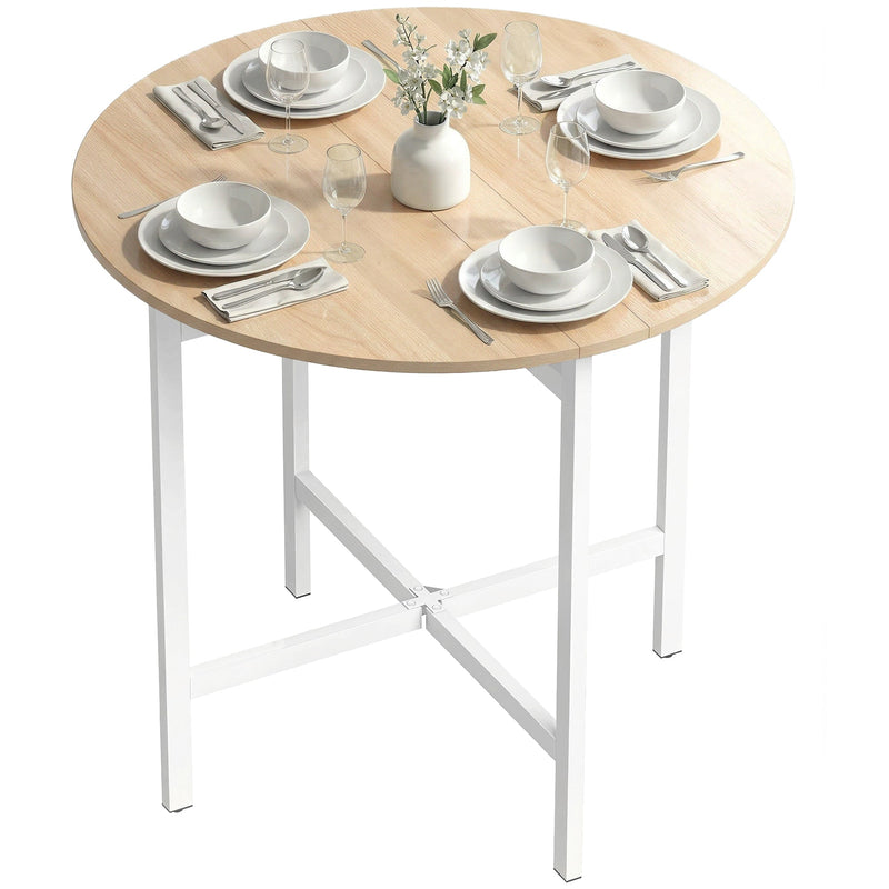 Round folding table with white legs set with four place settings and a vase