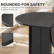 Black folding dining table in a small kitchen setting
