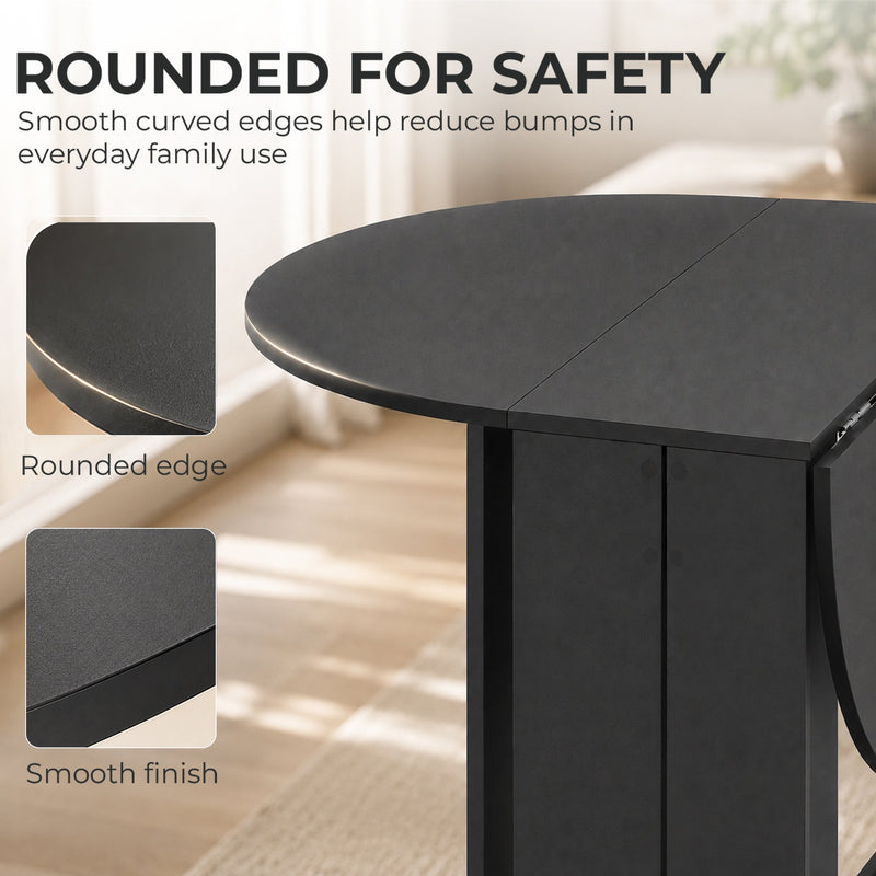 Black folding dining table in a small kitchen setting