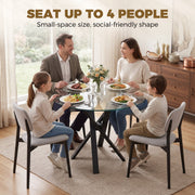 Family of four eating at the round glass dining table