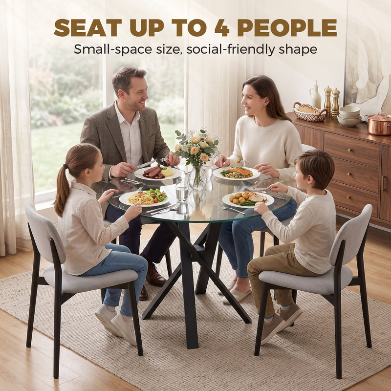 Family of four eating at the round glass dining table