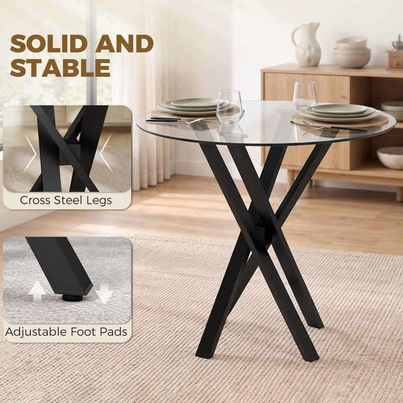 Black cross steel legs and adjustable foot pad detail on the glass dining table