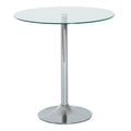 Round clear glass dining table with a chrome metal base, studio shot