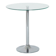 Round clear glass dining table with a chrome metal base, studio shot
