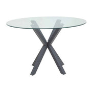 Round glass dining table with grey metal legs, studio shot