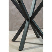 Round glass dining table with grey metal legs, studio shot