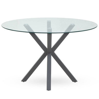 Round glass dining table with grey metal legs, studio shot