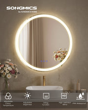 Round LED mirror glowing above a bathroom basin with icons for colour temperature, brightness, defog and IP44