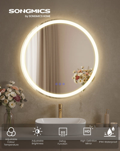 Round LED mirror glowing above a bathroom basin with icons for colour temperature, brightness, defog and IP44