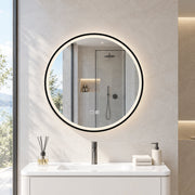 Round LED bathroom mirror above a white vanity unit with a shower behind