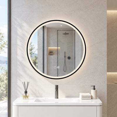 Round LED bathroom mirror above a white vanity unit with a shower behind