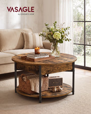 Round rustic brown coffee table in a living room in front of a sofa with a vase and candle on top