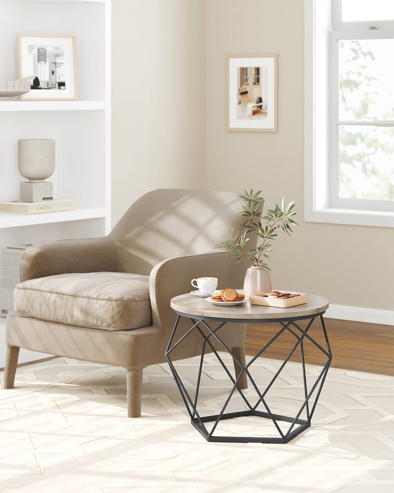 Lifestyle photo of the large coffee table beside an armchair with coffee, macarons and a vase on top