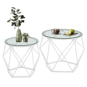 Set of 2 round glass coffee tables with white geometric steel bases, large and small side by side