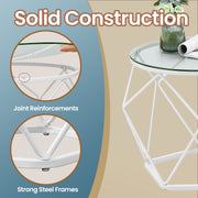 Close-up of the geometric white steel base under the glass tabletop