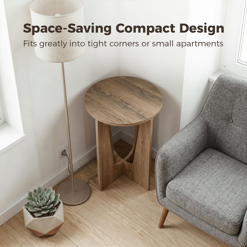 Compact side table in a corner between a floor lamp and a grey armchair