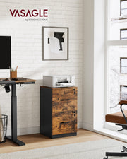 Rustic brown and black Vasagle file cabinet in a home office lifestyle scene beside a standing desk and printer