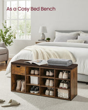Shoe bench used as a bed-end bench in a bedroom holding a magazine and throw