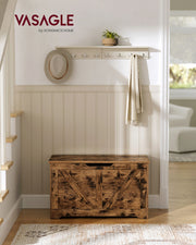 Storage chest styled in a bedroom setting at the foot of a bed