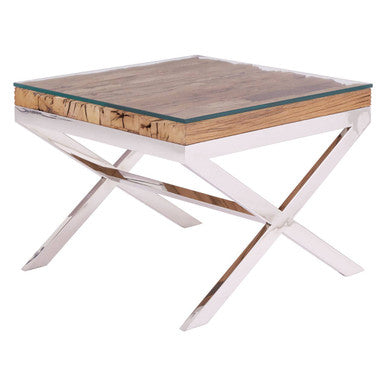 Natural wood and glass top side table with polished steel X-frame on a plain background