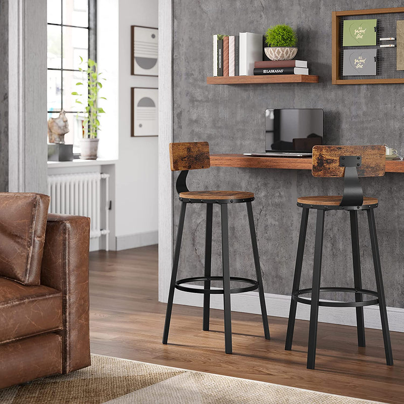 Two brown bar stools at a wall-mounted breakfast bar in a home office