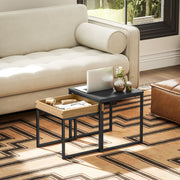 Nesting tables styled in a living room with a patterned rug and a leather armchair