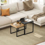 Nesting tables styled in front of a neutral sectional sofa with plantation shutters
