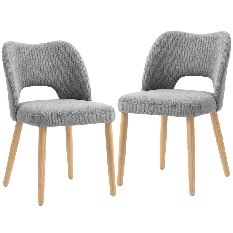Two grey chenille dining chairs with natural rubberwood legs on a white background