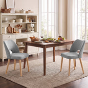 Two grey dining chairs at a table in a kitchen diner