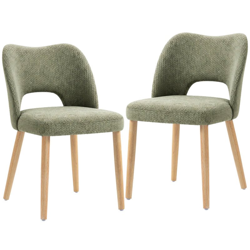 Two green chenille dining chairs with natural rubberwood legs on a white background
