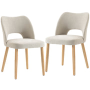 Two beige chenille dining chairs with natural rubberwood legs on a white background