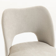 Close-up of the beige chenille backrest cut-out and fabric texture