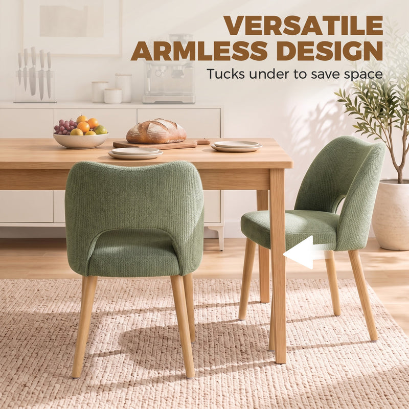 Armless green dining chairs tucked under a wooden table