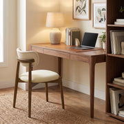 Beige dining chair used at a wooden home office desk