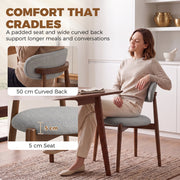 Woman relaxing on a grey chair with a 5 cm padded seat and 50 cm curved back