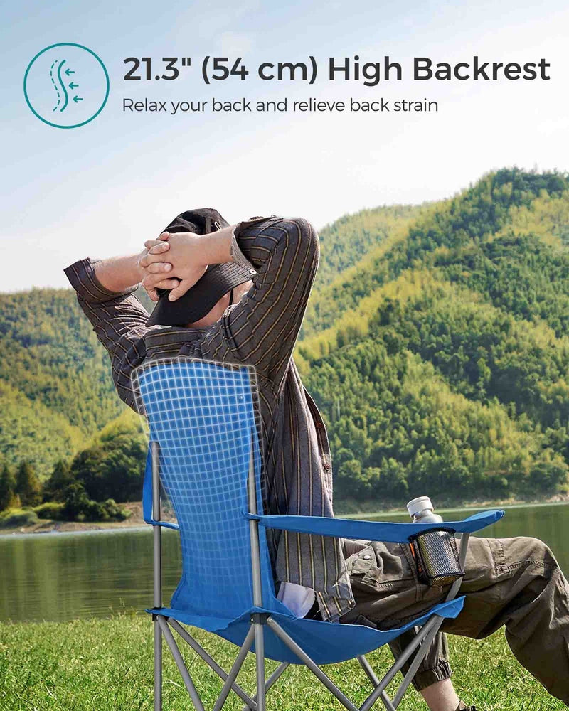 Man leaning back in the blue camping chair by a lake, with a note about the 54 cm high backrest