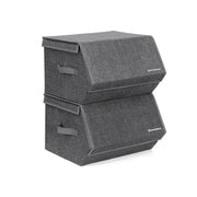 Two grey fabric storage boxes stacked with their magnetic lids closed