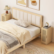 Bedside tables either side of a bed with an upholstered headboard