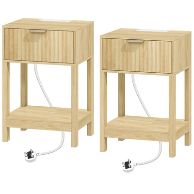 Pair of oak fluted bedside tables with drawers and open shelves, power cables trailing from each