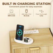 Close-up of the built-in charging station with a phone and watch charging on the tabletop