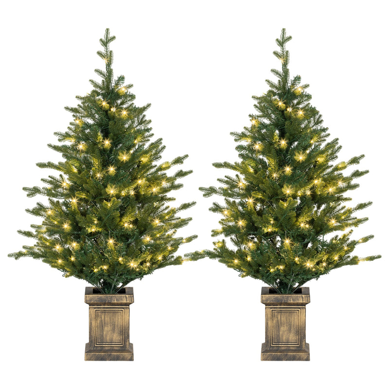 Pair of pre-lit 4ft Christmas trees in distressed bronze pots on a white background