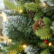 3ft set Christmas tree close-up of frosted tips with a pinecone and berry