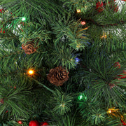 Close-up of pine needles with a pine cone, red berries and coloured lights
