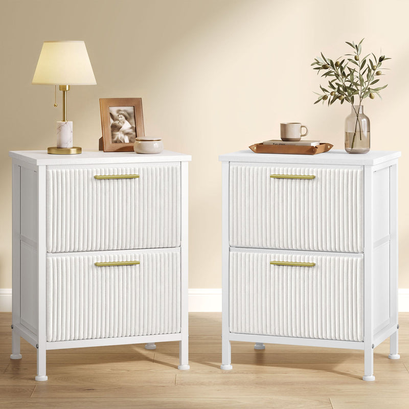 Set of 2 snow white corduroy bedside tables with gold handles, one topped with a lamp and the other with a vase