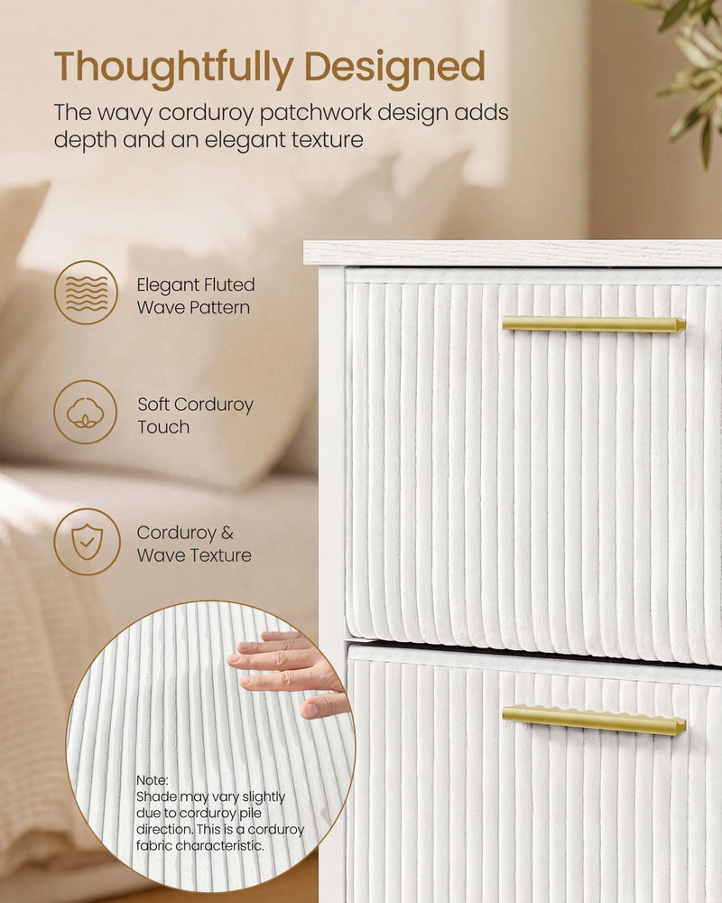 Close-up of the fluted wave corduroy drawer fronts and gold handles with a hand feeling the soft texture