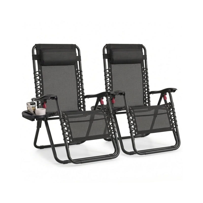 Set of 2 black zero gravity reclining chairs with clip-on side trays and headrest pillows