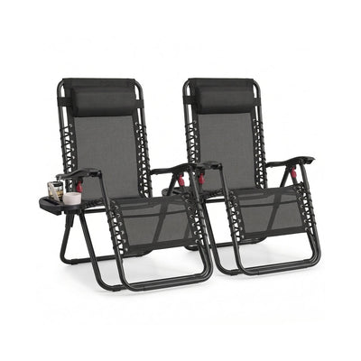 Set of 2 black zero gravity reclining chairs with clip-on side trays and headrest pillows