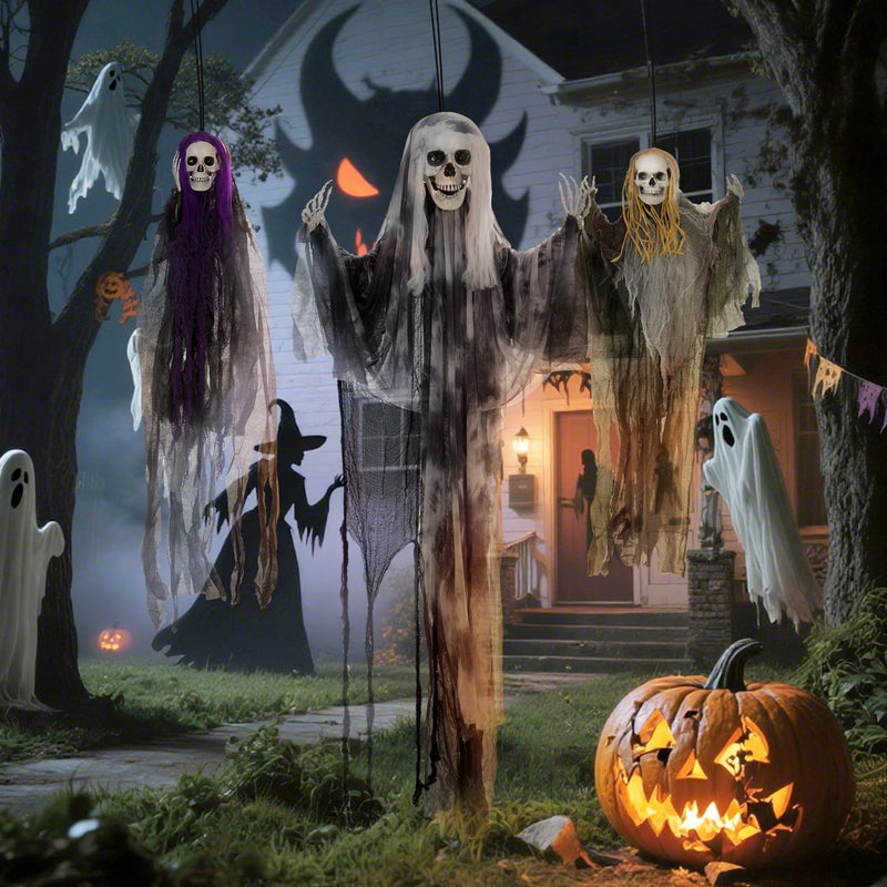 Three hanging skeleton decorations displayed among trees in a Halloween garden scene