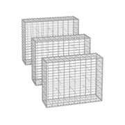 Three silver galvanised gabion cages angled in a row on a white background