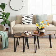 Bright living room with a beige sofa, round mirror and flowers beside the tables